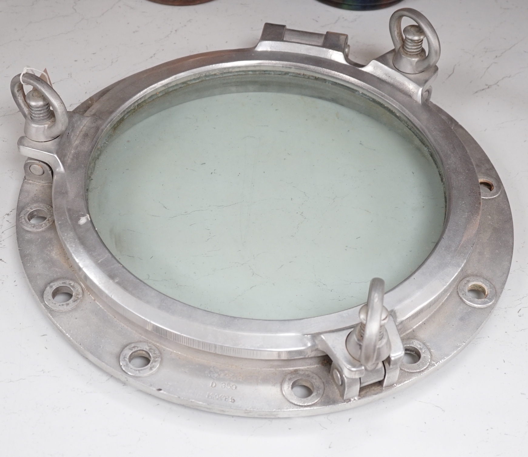 A vintage aluminium ship’s porthole, 50cm diameter